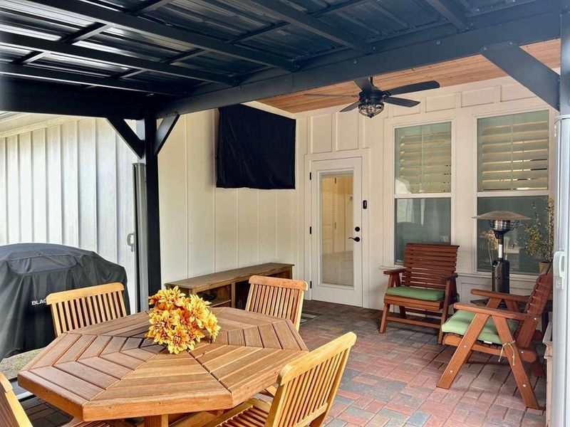 View of patio with ceiling fan