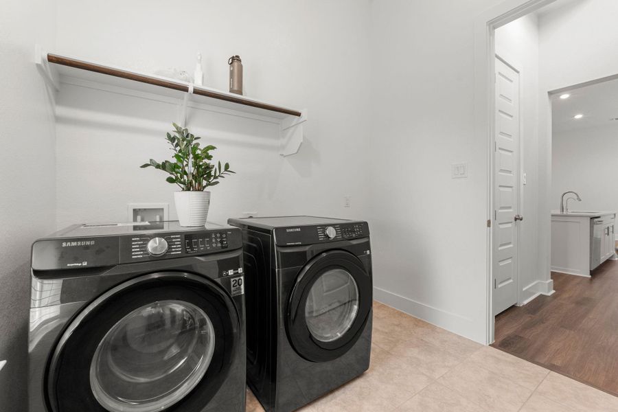 Laundry area featuring washing machine and dryer, tile patterned flooring, baseboards, and recessed lighting Laundry area featuring washing machine and dryer, tile patterned flooring, baseboards, and recessed lighting