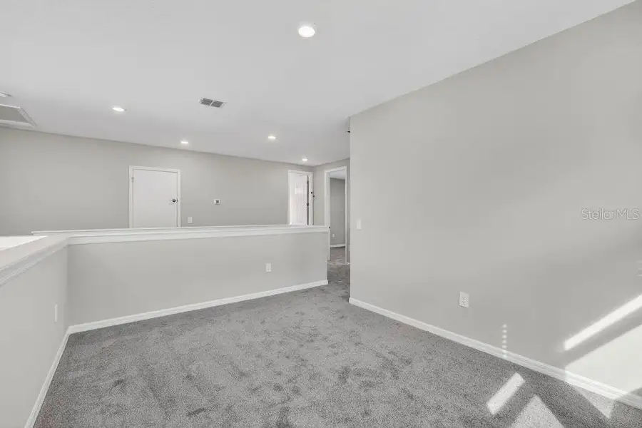 Spacious, unfurnished interior of a new home in Firethorn, Parrish (Image 17).