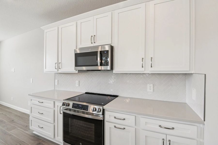 Stainless steel appliances cabinets and drawers with the AW Collection® Timeless as the backdrop