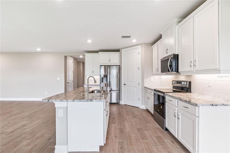 Furnished interior view inside a new home in Burnt Store Village, Punta Gorda (Image 7).