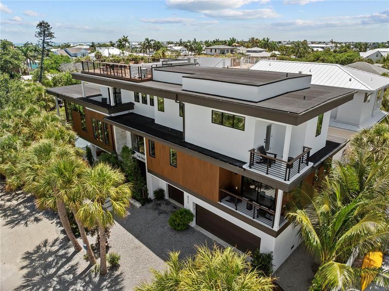 Front exterior of a new home in , Anna Maria, FL, highlighting curb appeal (Image 1). Front exterior of a new home in , Anna Maria, FL, highlighting curb appeal (Image 1).