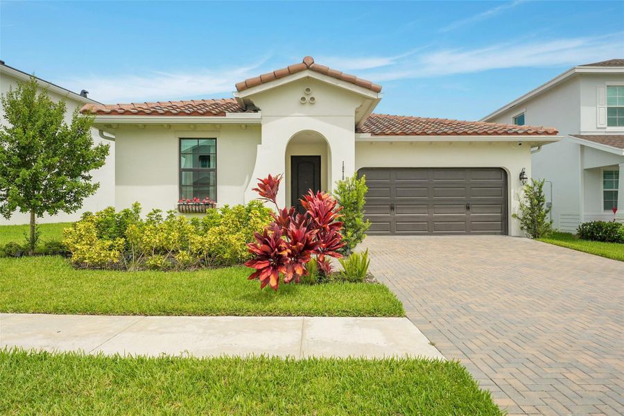 Front exterior of a new home in , Loxahatchee, FL, highlighting curb appeal (Image 28).