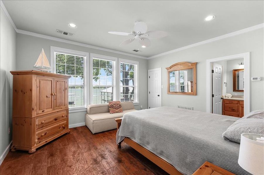 Bedroom with dark wood-style flooring, recessed lighting, ornamental molding, a ceiling fan, and ensuite bathroom