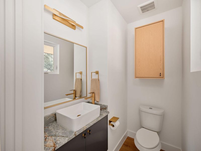 Bathroom featuring vanity and wood finished floors Bathroom featuring vanity and wood finished floors