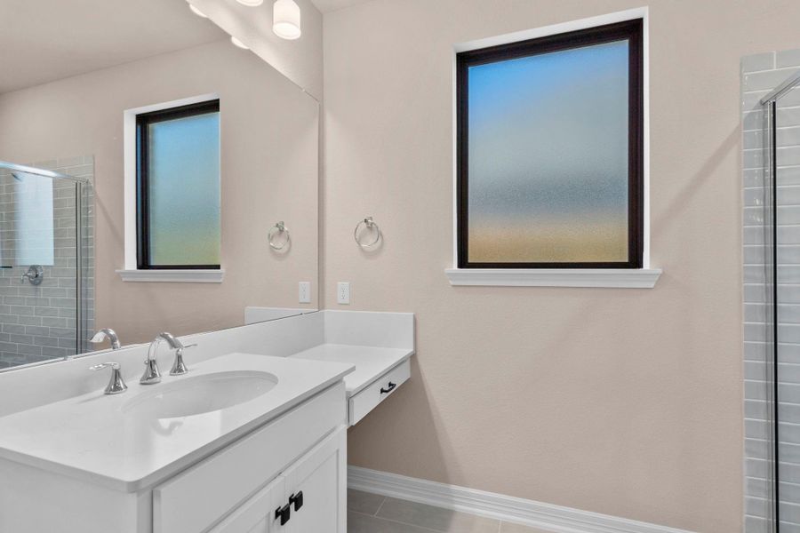 The en-suite bathroom offers a spa-like atmosphere with its elegant design, high end finishes, and tasteful lighting, creating a retreat within your own home. The en-suite bathroom offers a spa-like atmosphere with its elegant design, high end finishes, and tasteful lighting, creating a retreat within your own home.