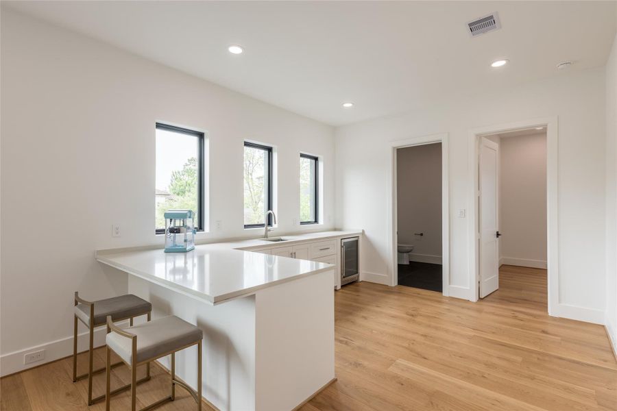 A sleek dry bar perfect for entertaining