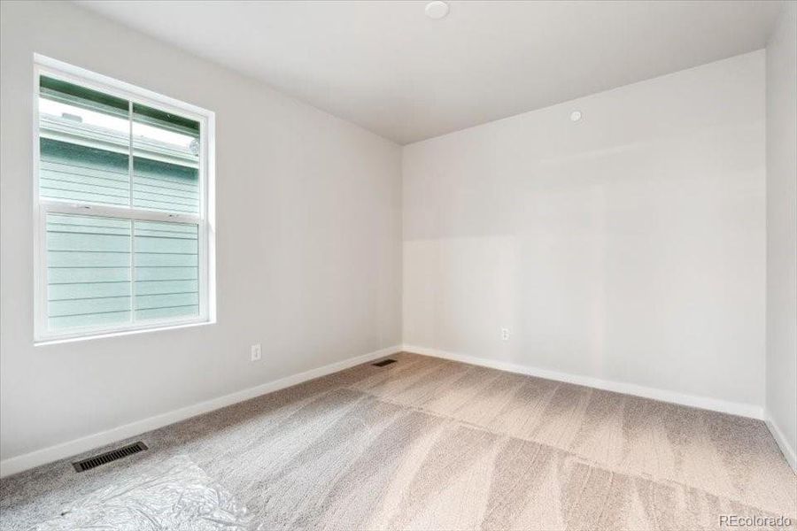 Spacious, unfurnished interior of a new home in Legato, Commerce City (Image 17).