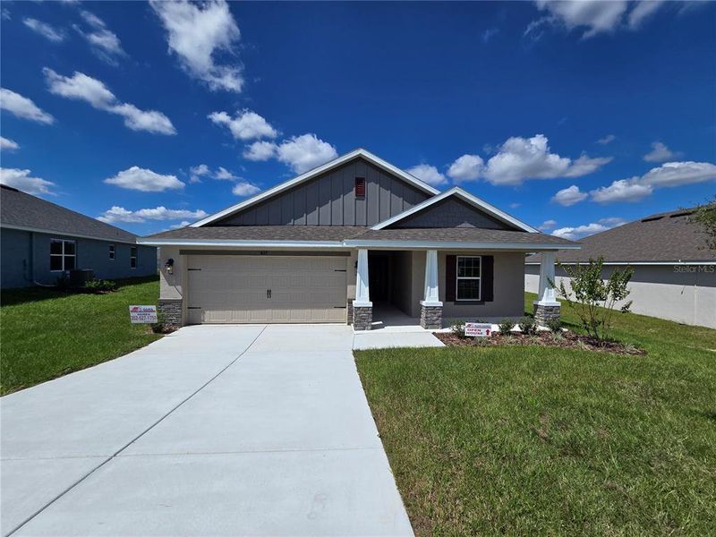 Front exterior of a new home in Twisted Oaks, Beverly Hills, FL, highlighting curb appeal (Image 2). Front exterior of a new home in Twisted Oaks, Beverly Hills, FL, highlighting curb appeal (Image 2).