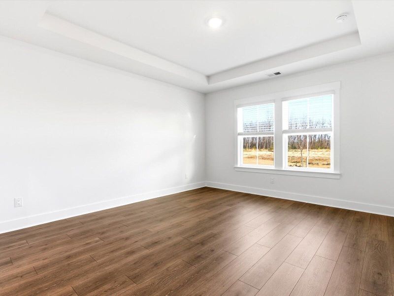 Spacious, unfurnished interior of a new home in The Coves at Lakes of Cane Bay, Summerville (Image 16).