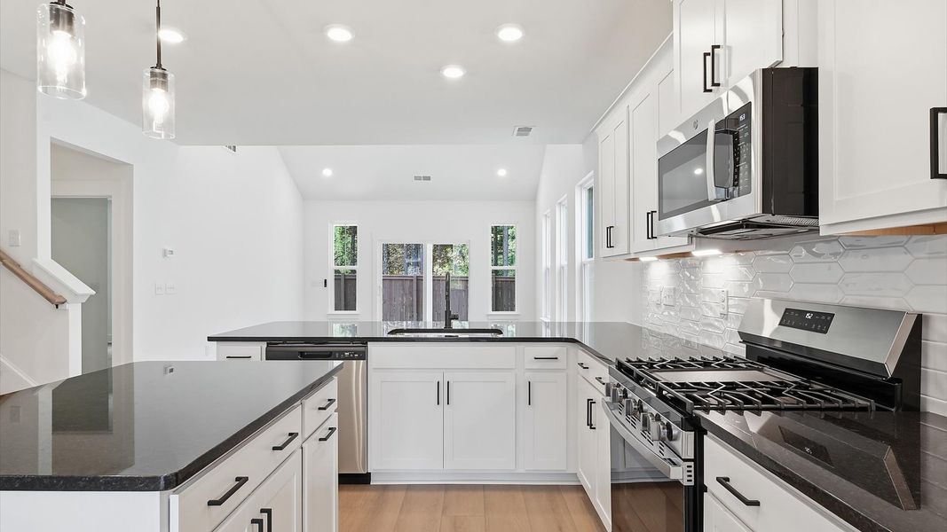 Accomplished design in a kitchen that blends function and form with a right-sized island Accomplished design in a kitchen that blends function and form with a right-sized island