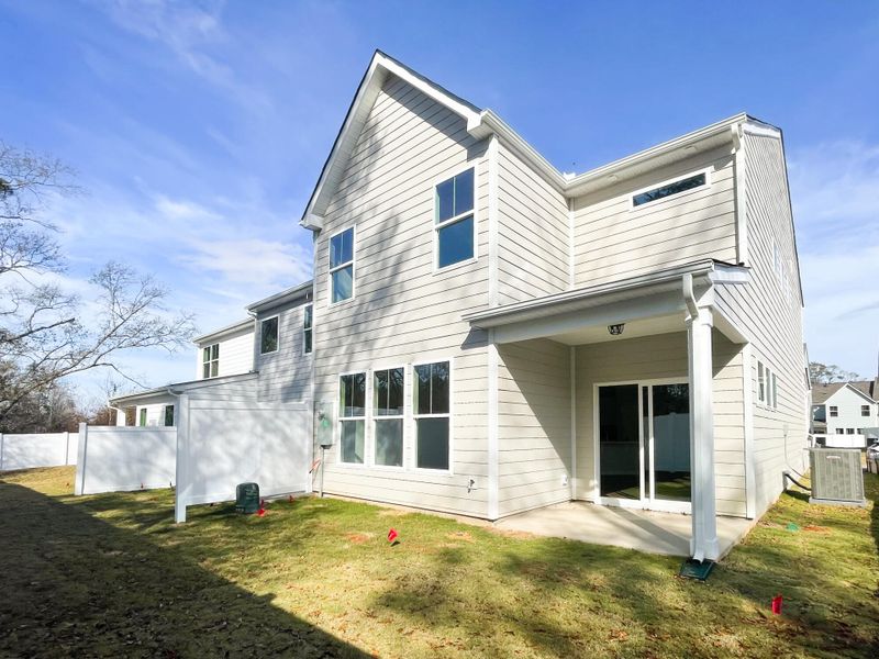 Exterior details and patio area of a home in Riverbrooke Townhomes, Simpsonville (Image 2).