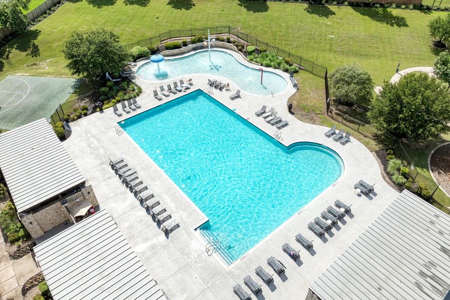 An inviting community pool with ample lounging space, perfect for warm-weather relaxation and recreation.
