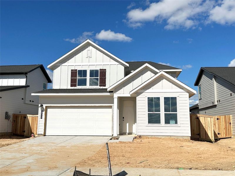 Front exterior of a new home in 45' Traditional Homes at Elyson, Katy, TX, highlighting curb appeal (Image 1). Front exterior of a new home in 45' Traditional Homes at Elyson, Katy, TX, highlighting curb appeal (Image 1).