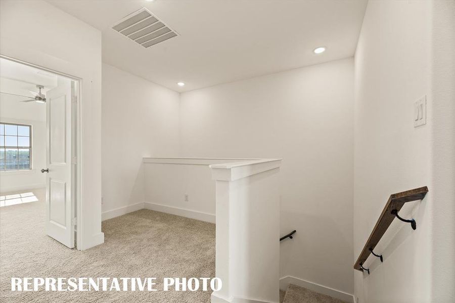 The loft at the top of the stairs makes a perfect pocket office or reading nook. REPRESENTATIVE PHOTO