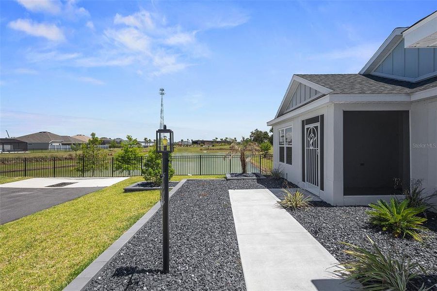 Front exterior of a new home in , The Villages, FL, highlighting curb appeal (Image 24).