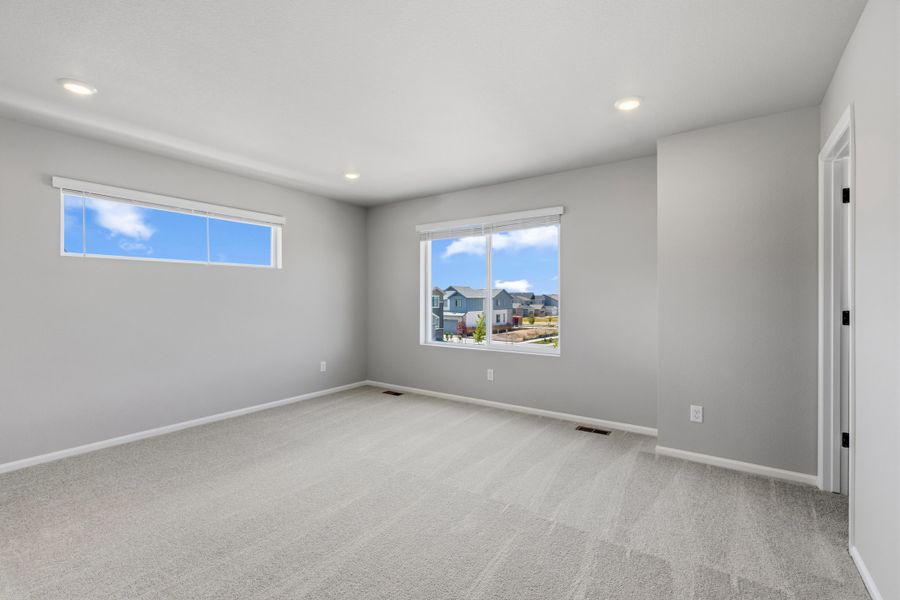 Spacious, unfurnished interior of a new home in Woodrose at Painted Prairie, Aurora (Image 12).