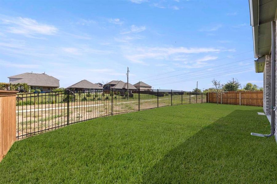 Exterior details and patio area of a home in Inspiration, Lucas (Image 18).
