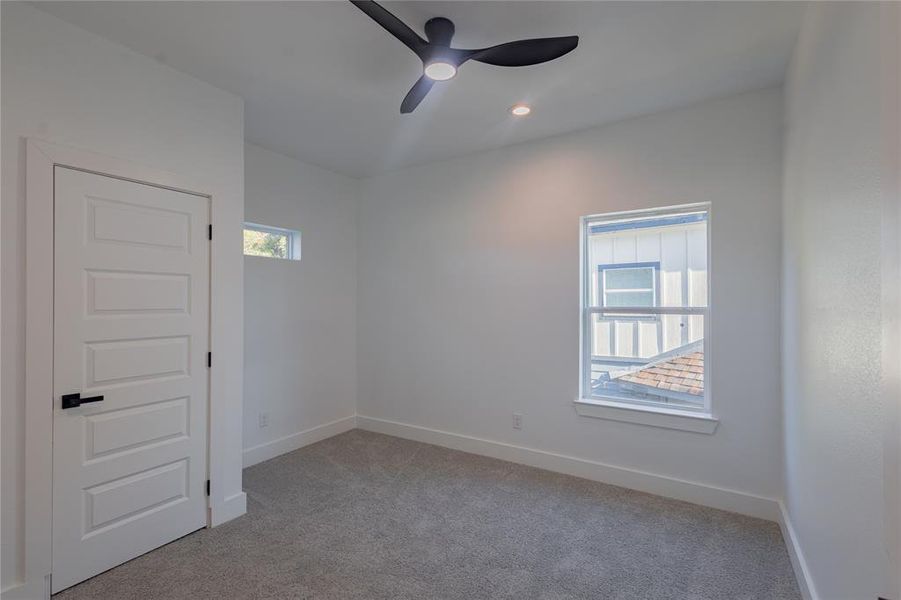 2nd Bedroom featuring light colored carpet, a ceiling fan, and recessed lighting 2nd Bedroom featuring light colored carpet, a ceiling fan, and recessed lighting