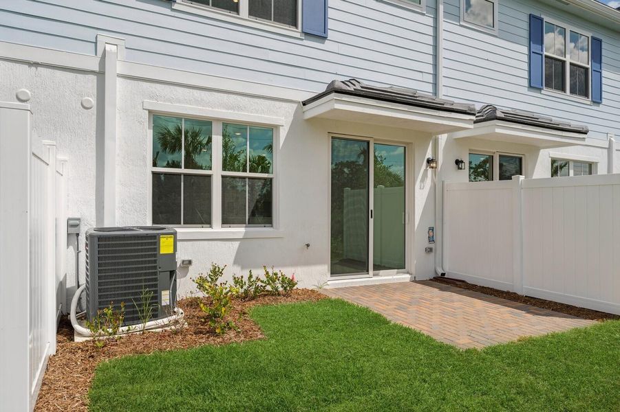 Exterior details and patio area of a home in Salerno Reserve Townhomes, Stuart (Image 3).