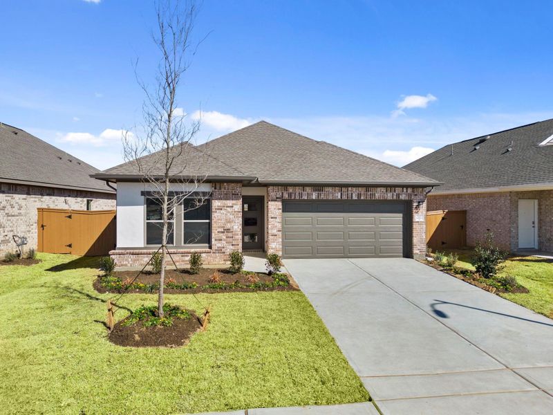Front exterior of a new home in Cypress Green, Hockley, TX, highlighting curb appeal (Image 22).