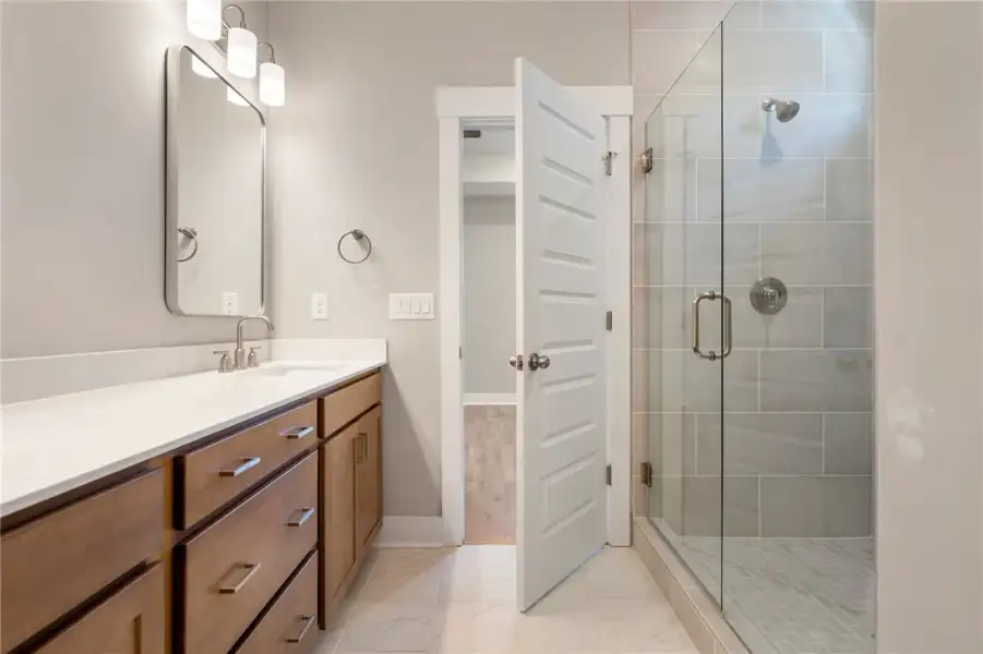 A well-appointed bathroom features a spacious vani