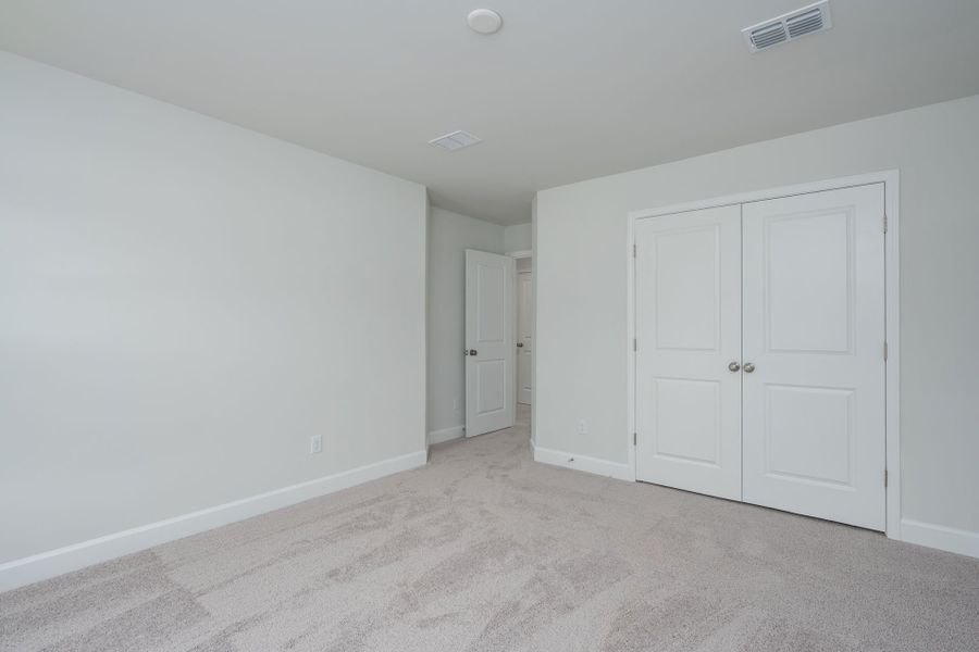 A large secondary bedroom A large secondary bedroom