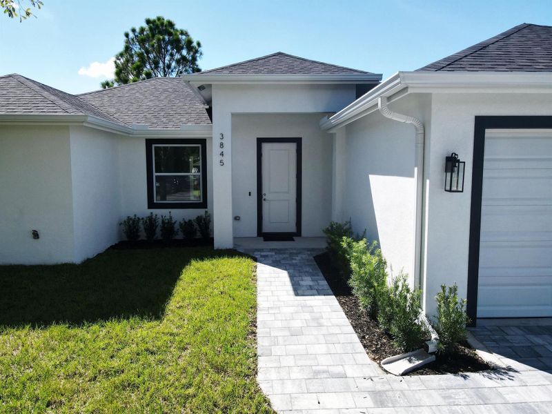 Front exterior of a new home in , Okeechobee, FL, highlighting curb appeal (Image 20).