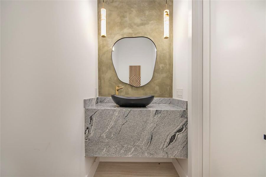 Bathroom featuring vanity and wood finished floors