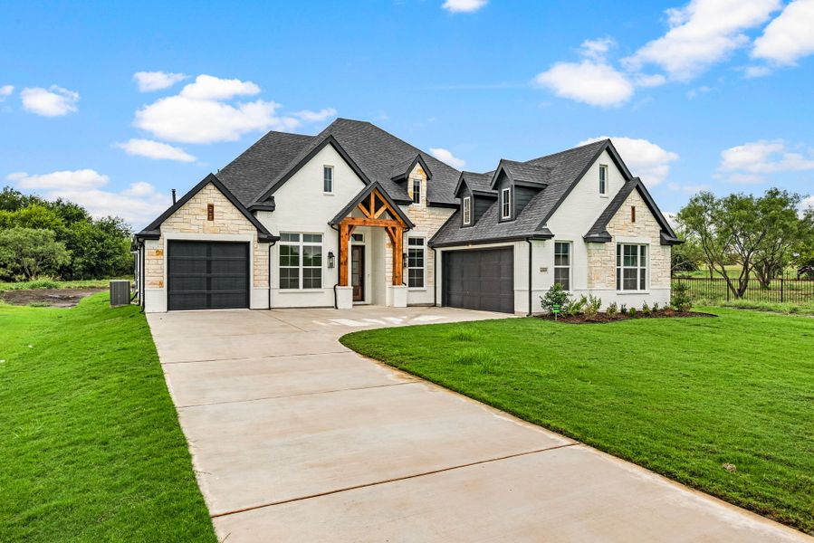 Front exterior of a new home in Rolling Creek Ranch, Aledo, TX, highlighting curb appeal (Image 27). Front exterior of a new home in Rolling Creek Ranch, Aledo, TX, highlighting curb appeal (Image 27).