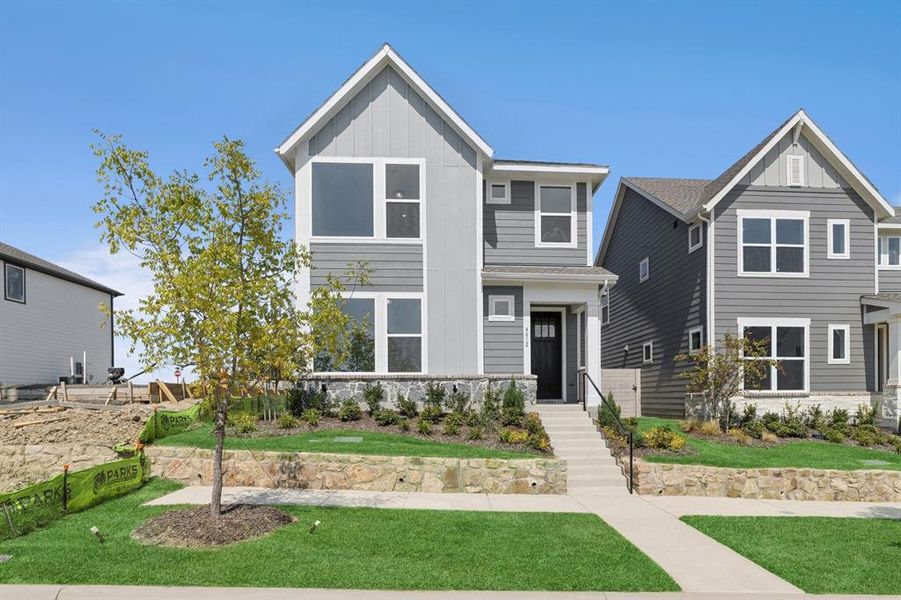 Front exterior of a new home in Painted Tree Woodland West – Cottages, McKinney, TX, highlighting curb appeal (Image 2). Front exterior of a new home in Painted Tree Woodland West – Cottages, McKinney, TX, highlighting curb appeal (Image 2).