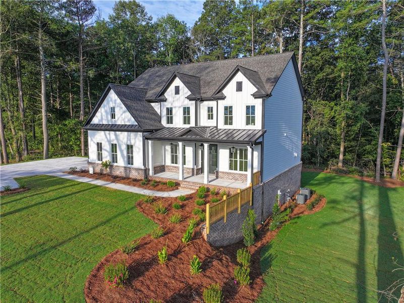 Front exterior of a new home in , Cumming, GA, highlighting curb appeal (Image 26). Front exterior of a new home in , Cumming, GA, highlighting curb appeal (Image 26).