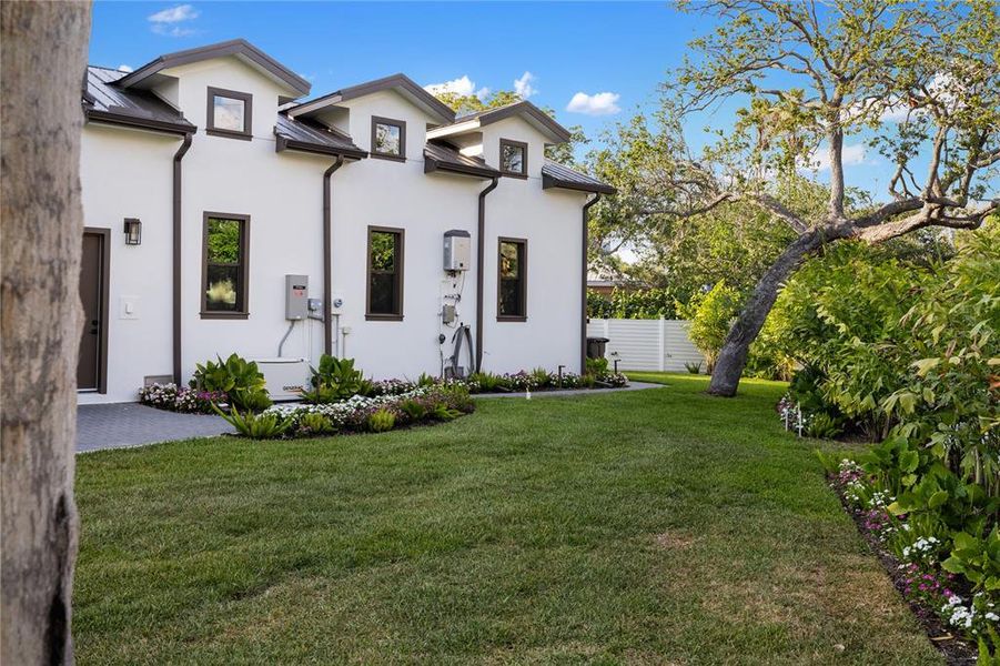 Front exterior of a new home in , Sarasota, FL, highlighting curb appeal (Image 25). Front exterior of a new home in , Sarasota, FL, highlighting curb appeal (Image 25).