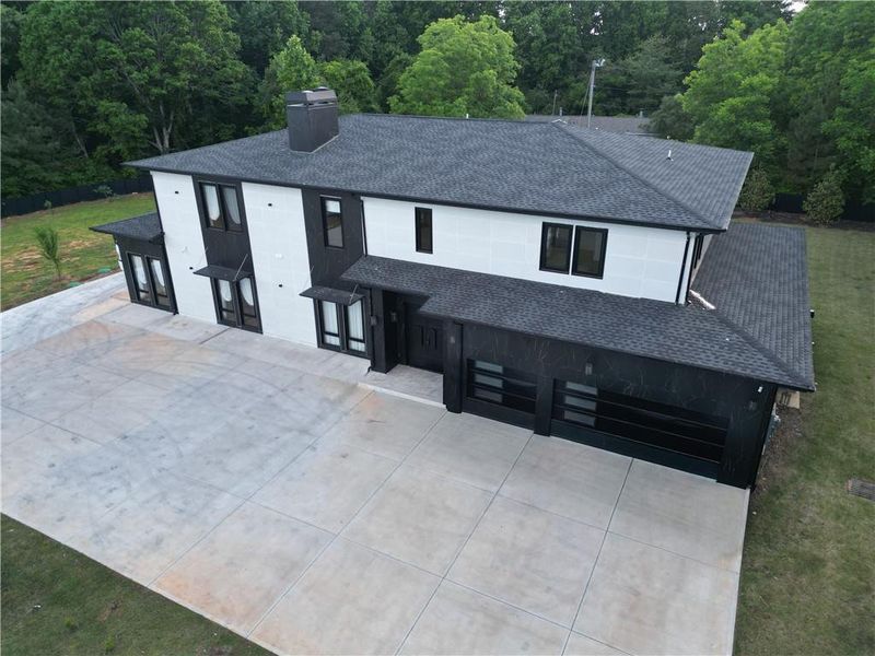 Front exterior of a new home in , Cumming, GA, highlighting curb appeal (Image 1). Front exterior of a new home in , Cumming, GA, highlighting curb appeal (Image 1).