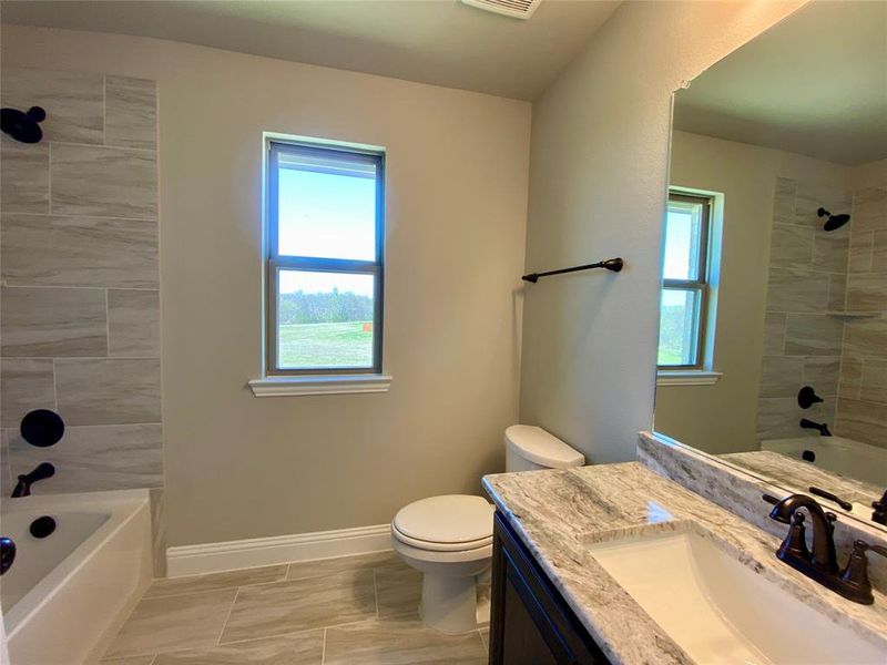 Bath 2  with window for natural light is shared by beds 2 & 3.