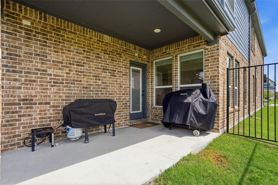 Exterior details and patio area of a home in The Villages of Hurricane Creek, Anna (Image 4).