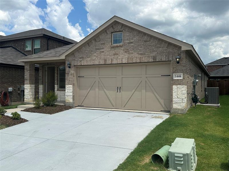 Front exterior of a new home in Cartwright Ranch, Crandall, TX, highlighting curb appeal (Image 17). Front exterior of a new home in Cartwright Ranch, Crandall, TX, highlighting curb appeal (Image 17).