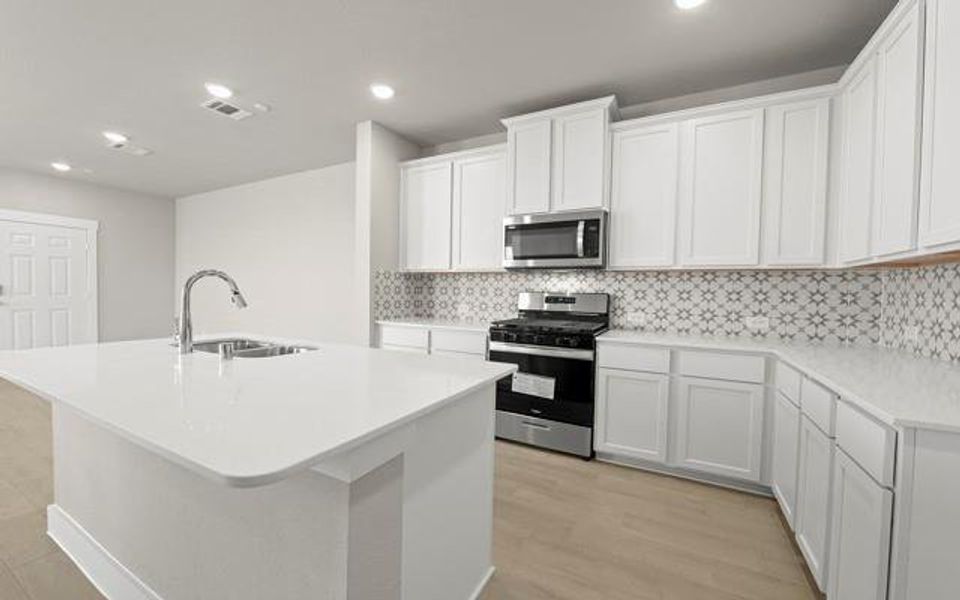 A spacious and luxurious kitchen to host holidays makes events most enjoyable.