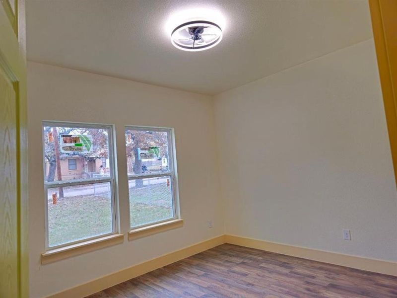 Unfurnished room featuring hardwood / wood-style floors