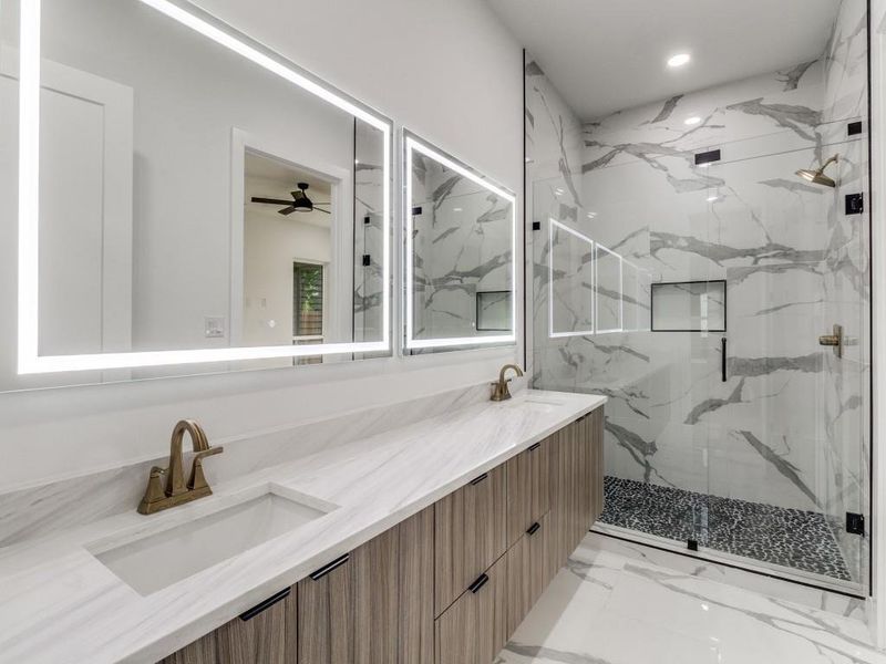 Full bath with a marble finish shower, double vanity, ceiling fan, marble finish floors, and recessed lighting