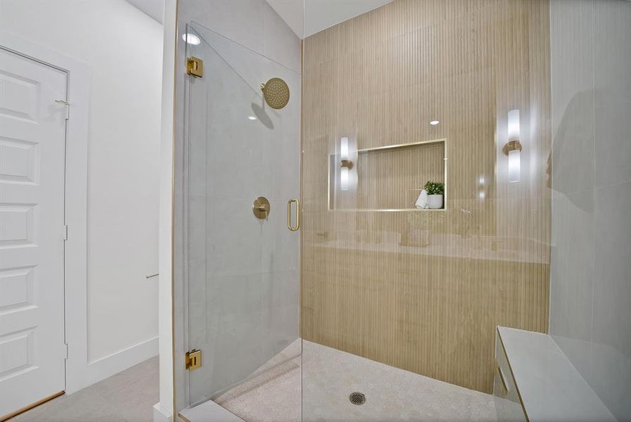 Bathroom featuring a stall shower and tile patterned floors Bathroom featuring a stall shower and tile patterned floors
