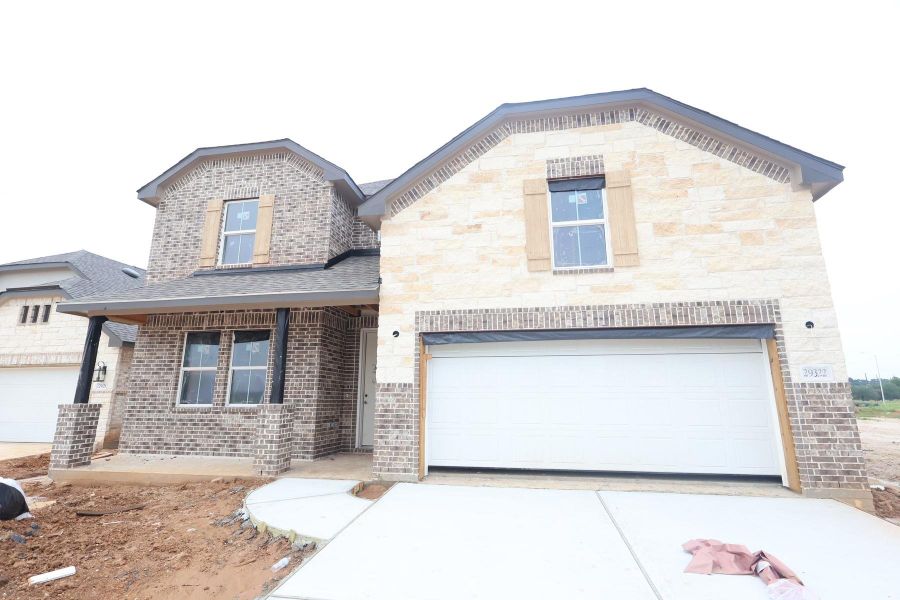 Two story home with 4 beds, 3.5 baths, and 2 car garage.