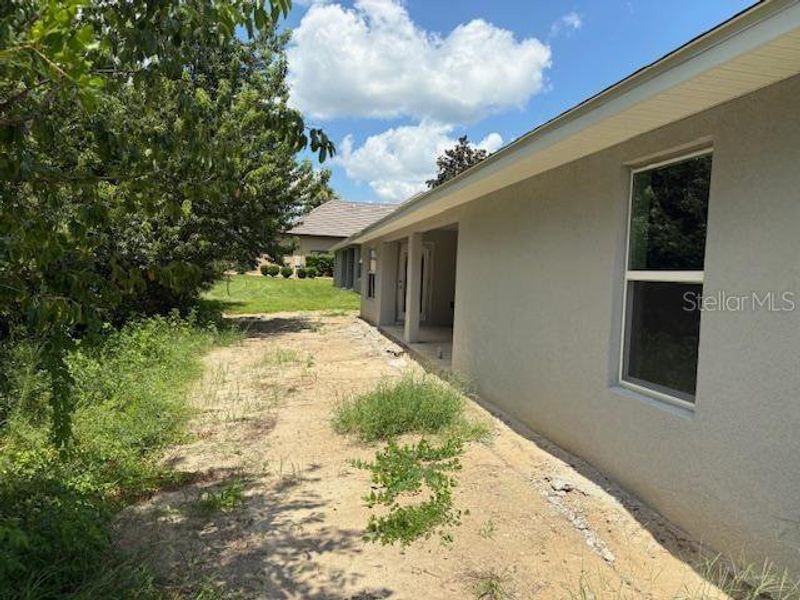Front exterior of a new home in Juliette Falls, Dunnellon, FL, highlighting curb appeal (Image 2).