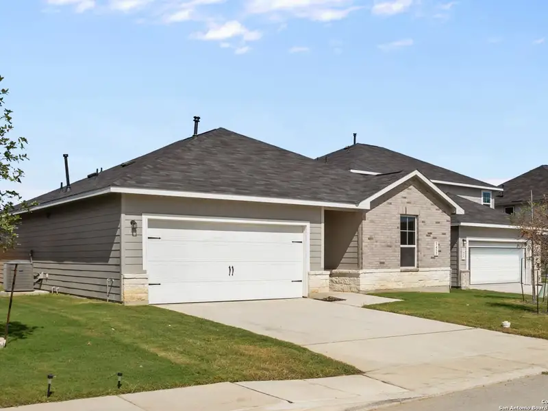 Front exterior of a new home in Horizon Pointe, Converse, TX, highlighting curb appeal (Image 1).