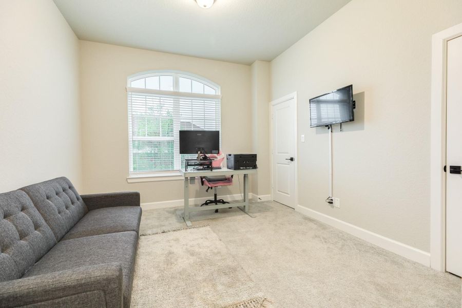 The third bedroom offers oversized windows that bring in plenty of natural light to compliment the high ceilings