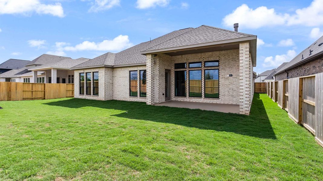 Exterior details and patio area of a home in Meridiana, Manvel (Image 2).