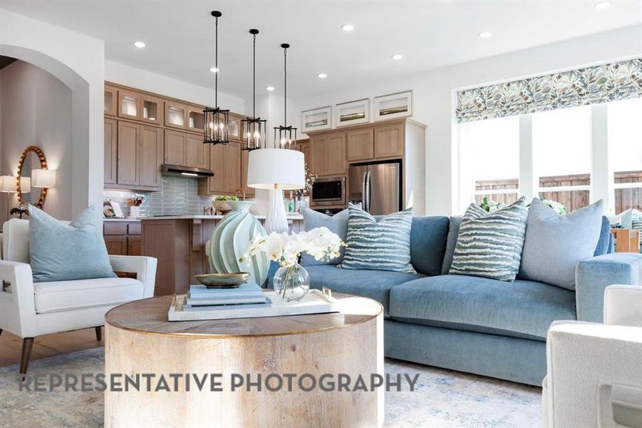 Living room with recessed lighting and arched walkways