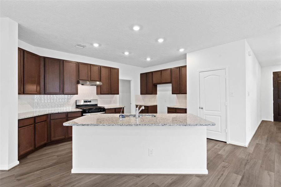 Thoughtfully designed as the true heart of the home, this kitchen serves as a warm and inviting centerpiece for both daily living and effortless entertaining. Thoughtfully designed as the true heart of the home, this kitchen serves as a warm and inviting centerpiece for both daily living and effortless entertaining.