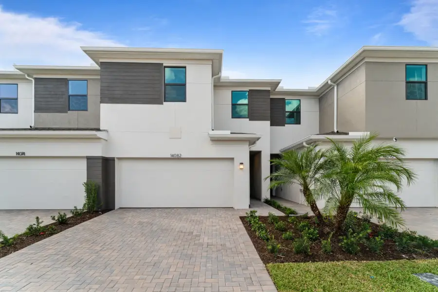 Front exterior of a new home in Tradition, Port St. Lucie, FL, highlighting curb appeal (Image 1). Front exterior of a new home in Tradition, Port St. Lucie, FL, highlighting curb appeal (Image 1).