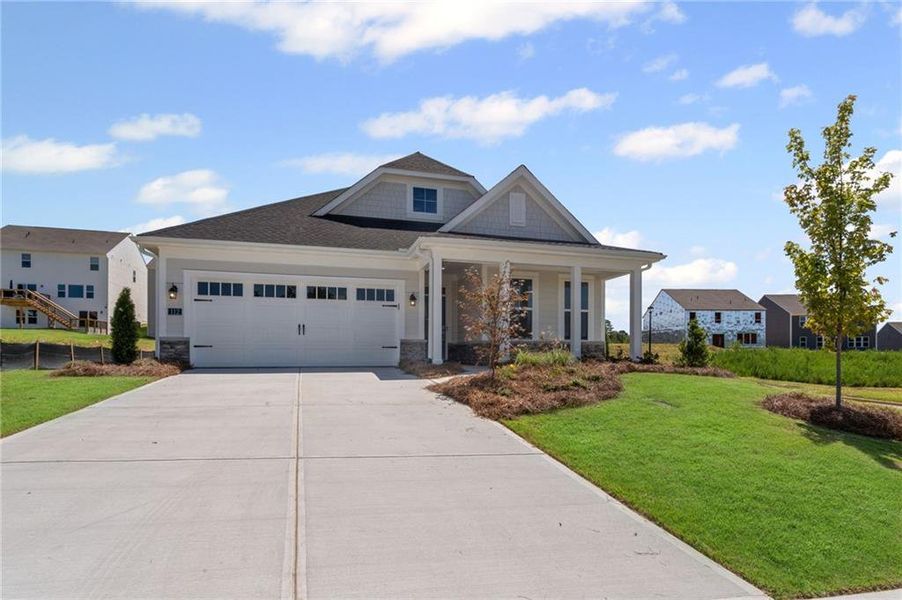 Front exterior of a new home in Twin Lakes, Hoschton, GA, highlighting curb appeal (Image 26). Front exterior of a new home in Twin Lakes, Hoschton, GA, highlighting curb appeal (Image 26).